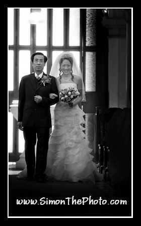 Kitty and his father walking down the aisle